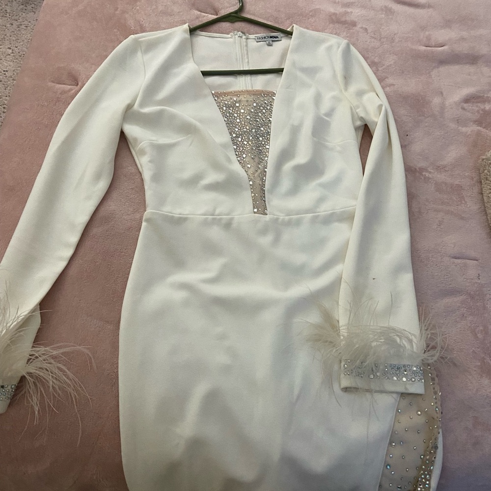 sparkly dress and fur at the end of sleeves